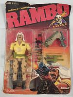 The entire blister card packaging showing the Nomad action figure, accessories, and Rambo branding with visible aging on packaging.
