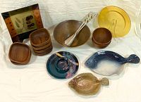 Overview showing various serving pieces including platters, bowls, and utensils.