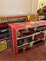 Talking Silver Rail Express G gauge train set in original box, showing locomotive engine, three cars, and station building.