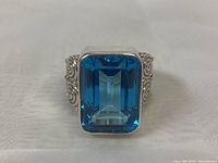 Front view of the 925 silver ring showing the large rectangular faceted London Blue stone.