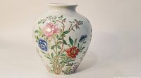 Front view of Chinese Famille Rose porcelain vase with multicolor floral pattern