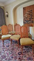Six chairs arranged in room showing overall lot