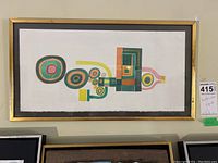 Full view of framed abstract watercolor showing overall composition, frame and hanging placement