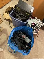 Overall view of multiple DJ lighting units and accessories in containers