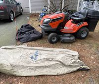 Overview showing mower, detached bagger bag, and TerraKing leaf bag cover
