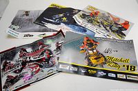 Set of six signed snowmobile racing posters arranged to show signatures and condition