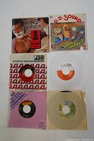Six 7 inch vinyl records with some in paper and cardboard sleeves. Various soul and funk artists. Includes Joe Tex, D.D. Sound, Sharp Edges covers visible.