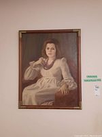 Front view of the framed painting with visible wall label