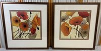 Two framed floral art prints side by side showing front view.