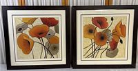 Pair of framed art prints showing the full front of both floral artworks side by side.
