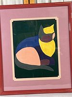 Front view of the framed abstract cat artwork showing the full image and matting.