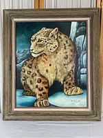 Frontal image of the original snow leopard painting in frame, showing detailed fur texture and background mountain landscape.
