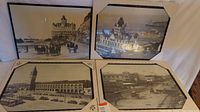 Four framed vintage black and white prints showing San Francisco landmarks including The Cliff House, Ferry Building, and Sutter Street.