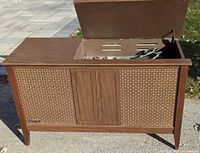 Front view of the Emerson console stereo with lid open showing turntable inside