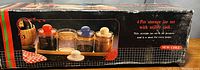 Photo of the original box showing the 4 piece airtight storage jar set with colorful lids and utility tack