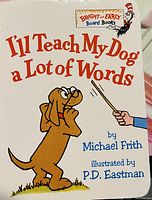 Cover of the "I'll Teach My Dog a Lot of Words" book by Michael Frith, illustrated by P.D. Eastman, showing the dog and Cat in the Hat mascot.