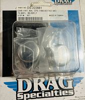 Photo of unopened Drag Specialties front axle caps in original packaging with label visible