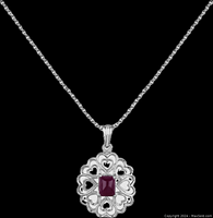 Silver pendant featuring reticulated heart design with square-cut natural ruby inlay set in center, hanging from thin silver chain