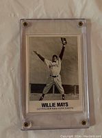 Front photo of 1977 TCMA Willie Mays baseball card in plastic case showing black and white action image of Willie Mays catching baseball.