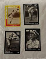 Front view of four Ty Cobb baseball cards. One color Goudey Baseball Greats card and three black & white vintage-style photo cards dated 1909, 1927, and 1928.