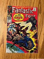 Front cover of Fantastic Four #62 comic showing title, issue number, price, and colorful action illustration.