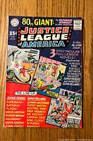 Front cover of Justice League of America #39 comic book with main title, character illustrations, and story highlights.