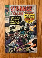 Front cover of Strange Tales #145 comic showing colorful action scene and title details
