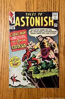 Front cover of Tales To Astonish #58 comic book showing Giant-Man and Colossus on it with text and logos.