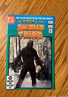 Front cover of The Saga Of The Swamp Thing #2 comic book showing the swamp creature and branding details