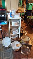 Full assortment of Corning Ware and Pyrex bakeware displayed on shelving