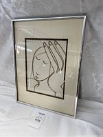 Full view of framed artwork showing the entire piece including the frame and matting.