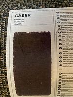 Close-up photo of GÅSER brown shag carpet label showing size 170x240 cm (5'7" x 7'10") and weight 18kg (40lbs). Sample swatch of carpet attached.