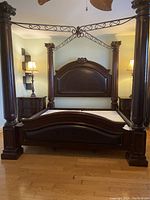 Full front view of assembled king size four poster bed showing headboard, footboard, posts and canopy rails