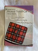 Front of box showing Zonetech Heated Travel Car Pad in red plaid pattern.