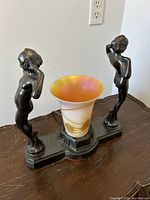 Front view of lamp on base, unlit