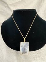 Full view of necklace and pendant on bust