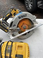 Side view of DeWalt circular saw showing blade and handle.