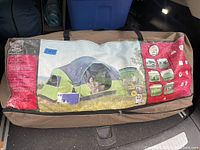 Closed carry bag for large family tent with printed label showing product details and brand Ventura.