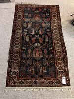 Full view of top side of rug showing overall pattern and wear