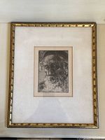 Full view of framed etching on wall