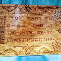 Close-up photo of plaque engraving showing text 'IF YOU WANT TO KNOW WHO IS THE BOSS - START SOMETHING' and decorative elements to confirm inscription and condition.