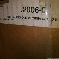 Box label displaying partial product description including "POL BRASS OLD VIRGINIA CHA", and model identifier related to a 6-light fixture.