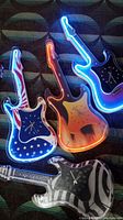 Photo showing four electric guitar neon clocks arranged on a patterned carpet, illuminated and turned on.