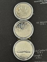 Obverse sides of 1978, 1979, and 1980 Canadian silver dollar coins showing maritime scenes with dates.