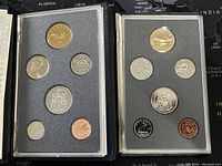 Two sets of Canadian specimen coins from 1988 and 1989 displayed side by side in protective cases with foam inserts.