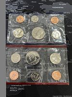 Two sets of 1989PD US proof-like coin sets shown sealed in original plastic packaging with 9 coins each