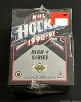 Front view of factory sealed 1990-91 Upper Deck NHL Hockey High # Series wax box showing NHL hockey logo, series name, and packaging condition.