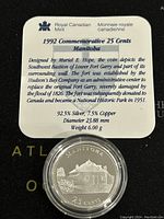 Close-up photo of the coin with the Royal Canadian Mint card showing coin details and historical background: 1992 commemorative 25 cents Manitoba design with specifications (92.5% Silver, 7.5% Copper, 23.88 mm diameter, 6.00 g weight).