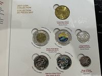 Set of six 2017 Canadian commemorative coins with a mix of non-colored and colorized designs attached to a collector card titled '2017 Coin Collection' with artist credits.