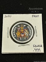 Front side of the 2020 Canadian 50 cents proof silver coin showing the colorful Canadian coat of arms.